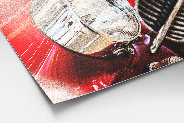 Close-up of a vintage car headlight photo printed on Hahnemühle Photo Rag Metallic paper, showing the paper's metallic shimmer and fine texture