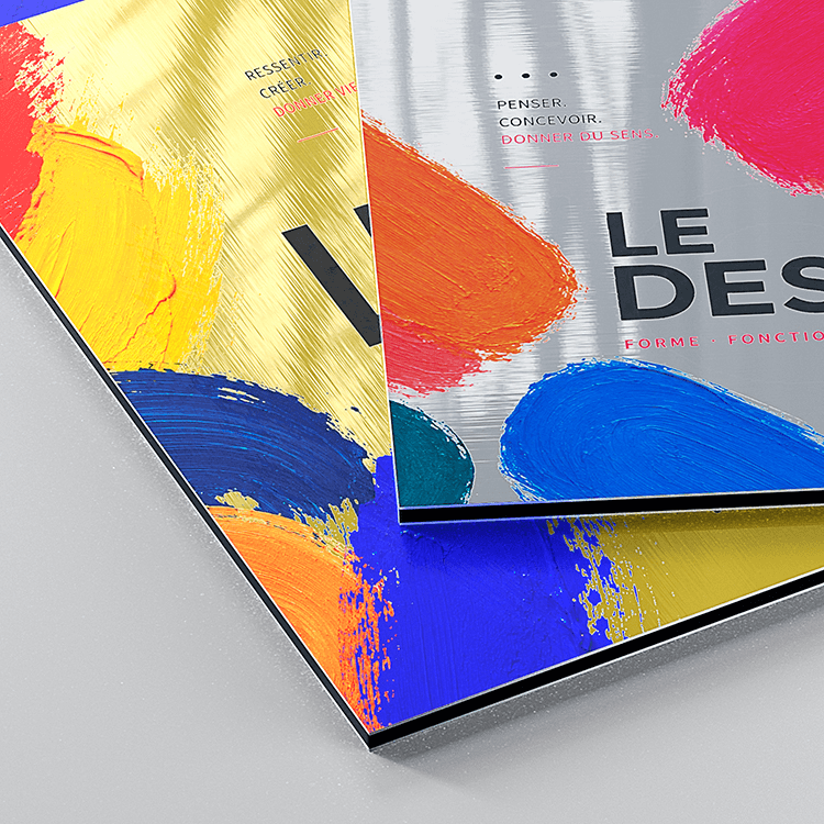 Two overlapping brushed aluminium Dibond panels with colourful paint stroke artwork, showing gold and silver metallic finishes
