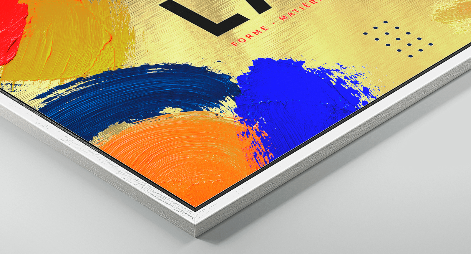 Corner detail of Dibond Gold print showing brushed golden metallic surface with colourful artwork and white wood frame