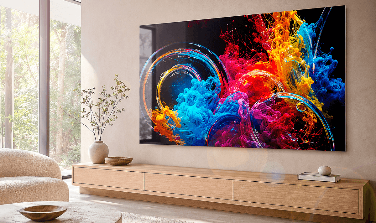 ChromaLuxe metal print of vibrant swirling ink colours against a dark background, showcasing bold abstract art in a modern living space