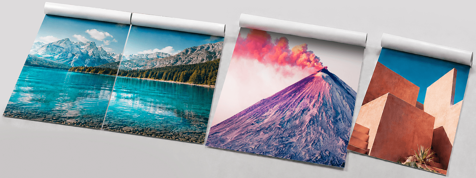 Collection of flexible photo prints with vibrant images spread on grey surface