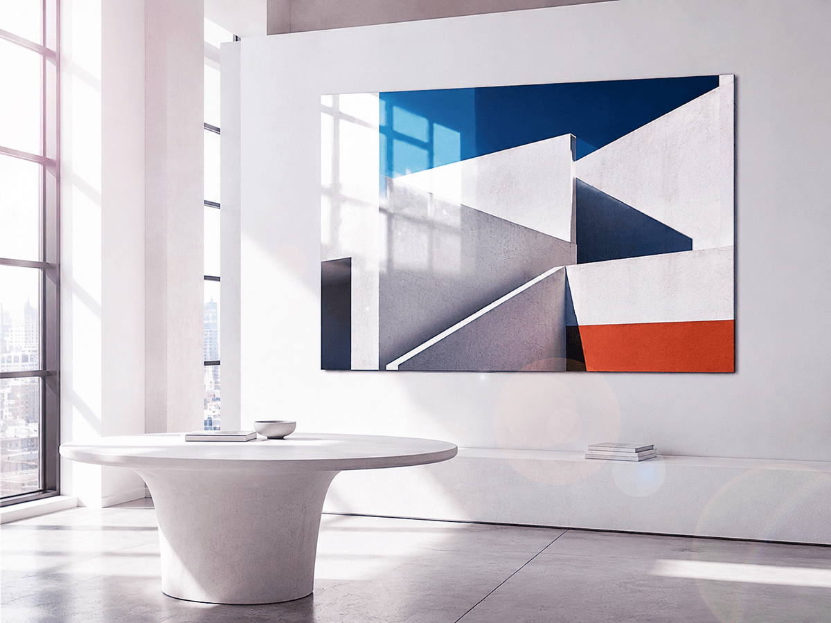 ChromaLuxe glossy print of geometric architectural photography with white angular shapes against blue sky, in a minimalist contemporary interior