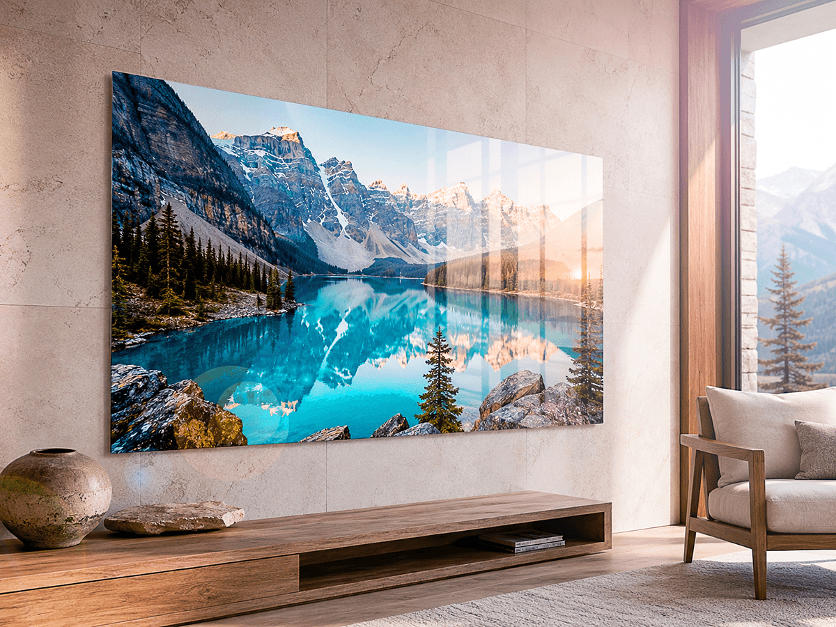 ChromaLuxe glossy print of a mountain lake with snow-capped peaks reflected in turquoise water, displayed in a modern living room