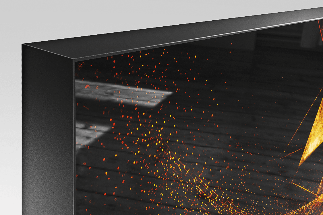Corner detail of Acrylux Framed print with silver aluminum frame flush with glossy acrylic surface