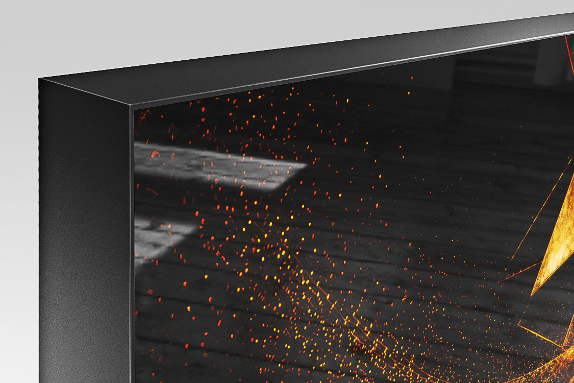 Corner detail of Acrylux Framed print with silver aluminum frame flush with glossy acrylic surface