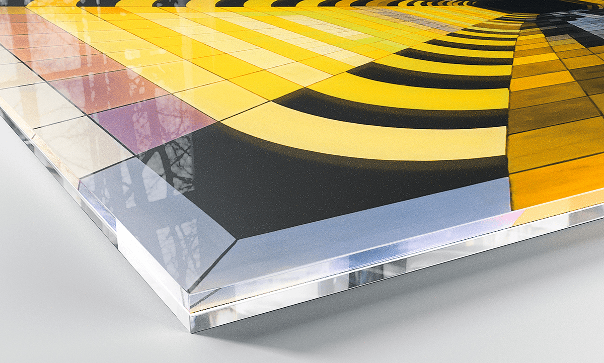 Corner detail of an Acrylux Gallery print showing thick clear plexiglass edge with vivid colours