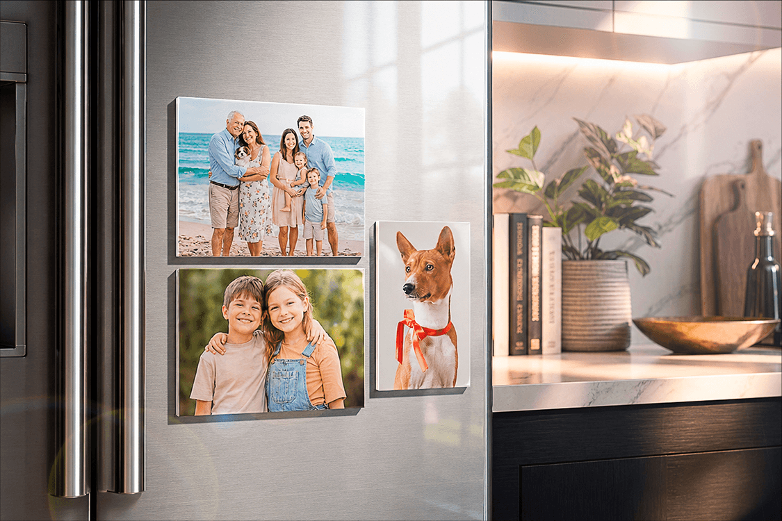 Multiple Acrylux Minis with family photos magnetically attached to stainless steel refrigerator in modern kitchen