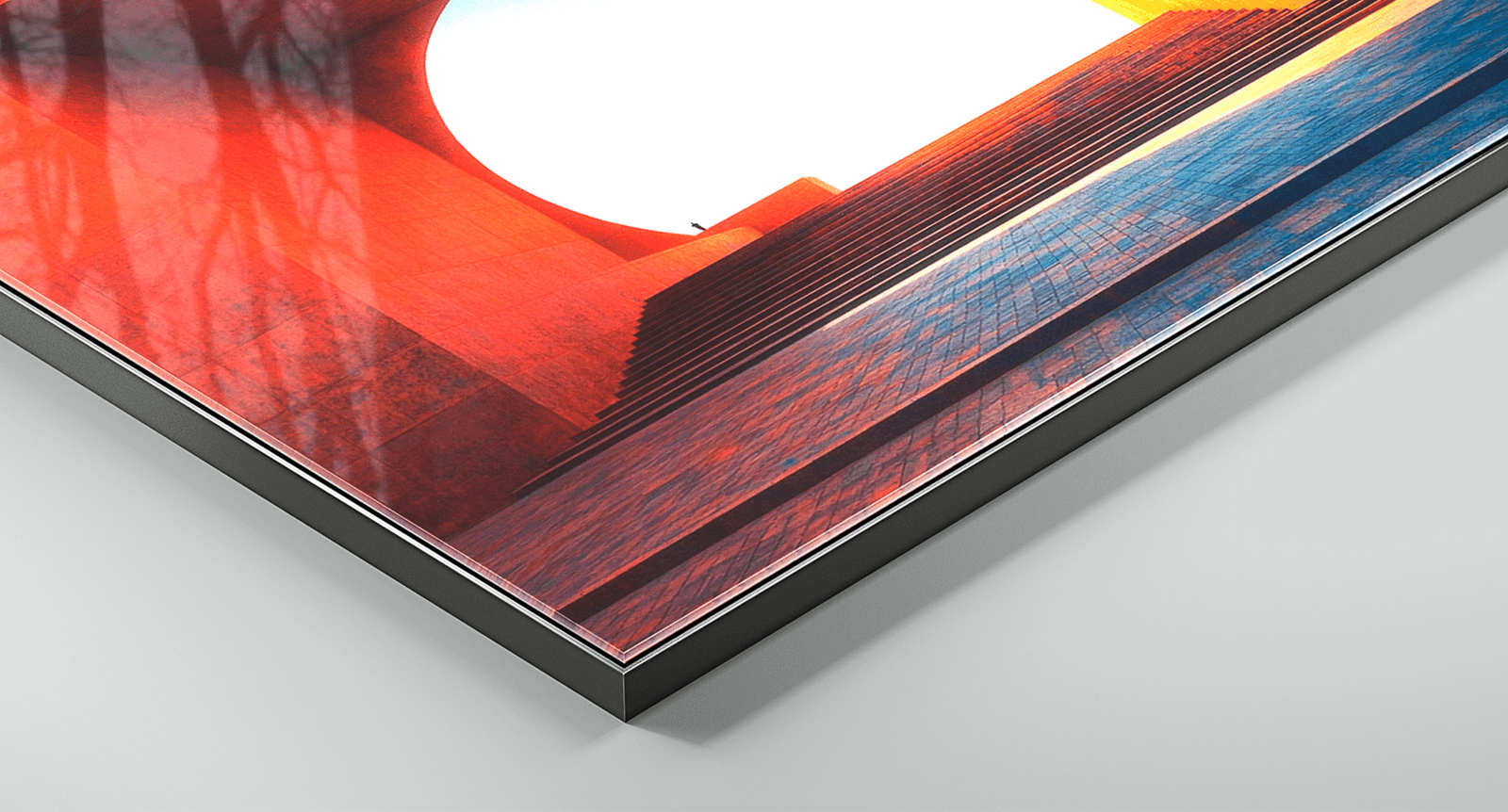 Corner detail of FinoArt print with black aluminium frame showing layered construction and sleek finish