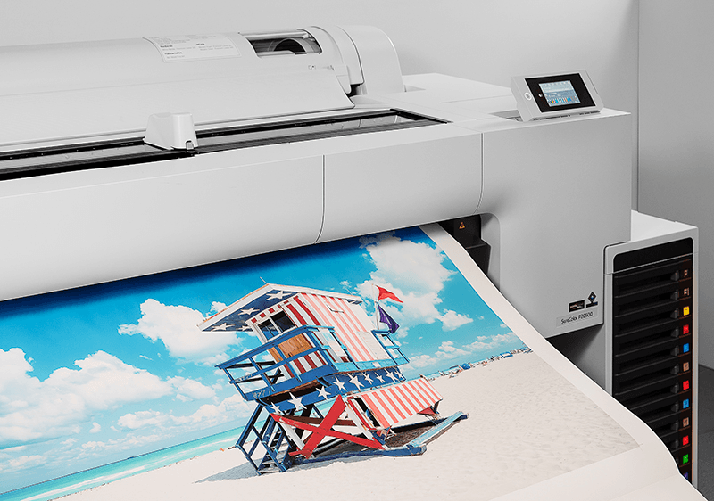 Epson large-format fine-art printer producing a photo print